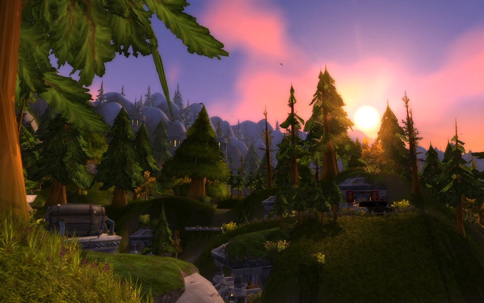 Loch Modan, in the middle of town, at sunset. The sun filters through the pine trees.